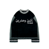 A grey oversized sweater with flared sleeves and unique embroidery on the front. The sweater has a distinct Mohair Style texture and is made of 100% Acrylic material using a double layer knitting technique. The sweater is unisex and offers versatility for all genders, making it perfect for layering over streetwear outfits.