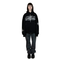 A black hoodie with unique rhinestone and screenprint design on the front, stars made of rhinestones on the sleeves and back, and a vintage, distressed finish. Made from a blend of cotton and polyester, with a peached interior for a cozy feel. Oversized unisex fit and extra big pocket make it practical for any occasion.