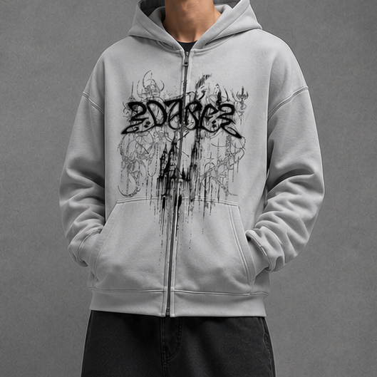 Person wearing a gray hoodie with a logo on a gray background