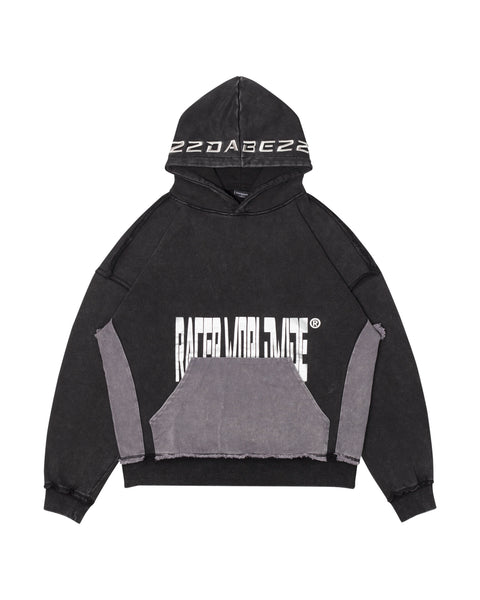 Image of a faded garment-dyed long sleeve hooded sweatshirt from the RacerWorldwide® x 22DABE22 collaboration. The sweatshirt features denim fabric details, silver embroidery on the hood, and a silver silkscreen print. The distressed finish adds texture and character to the oversized fit.