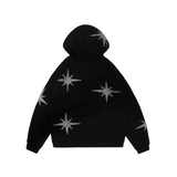 A black hoodie with unique rhinestone and screenprint design on the front, stars made of rhinestones on the sleeves and back, and a vintage, distressed finish. Made from a blend of cotton and polyester, with a peached interior for a cozy feel. Oversized unisex fit and extra big pocket make it practical for any occasion.