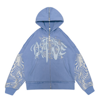A light blue hooded jacket with a split zipper at the back. The jacket features a glitter screen print and embroidery appliqué on the front, with additional glitter screen print detailing on the sleeves. The jacket has an oversized fit and a peached interior lining for a cozy feel. The custom 22 puller adds a unique touch to the zipper.