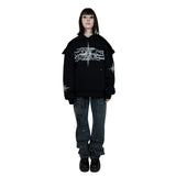 A black hoodie with unique rhinestone and screenprint design on the front, stars made of rhinestones on the sleeves and back, and a vintage, distressed finish. Made from a blend of cotton and polyester, with a peached interior for a cozy feel. Oversized unisex fit and extra big pocket make it practical for any occasion.