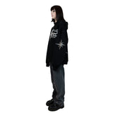 A black hoodie with unique rhinestone and screenprint design on the front, stars made of rhinestones on the sleeves and back, and a vintage, distressed finish. Made from a blend of cotton and polyester, with a peached interior for a cozy feel. Oversized unisex fit and extra big pocket make it practical for any occasion.