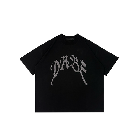 A black oversized shirt with a distressed finish and rhinestones on the front by 22DABE22. Made from 100% cotton and weighing 200 GSM, it's both comfortable and durable. The unisex design is versatile and can be worn alone or layered. Perfect for streetwear and casual occasions.