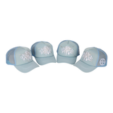 A light blue cap with a broken glass design embroidered on the front and the 22DABE22 logo on the side. The six-panel construction provides a comfortable fit with an adjustable strap at the back. The pre-curved visor protects from the sun and rain, and breathable eyelets keep the head cool and dry. Ideal for completing a streetwear outfit.