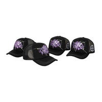 A black baseball cap with lilac broken glass design embroidered on the front and 22DABE22 logo on the side. The cap has a six-panel construction, adjustable strap at the back, pre-curved visor, and breathable eyelets. Perfect for completing a streetwear ensemble.