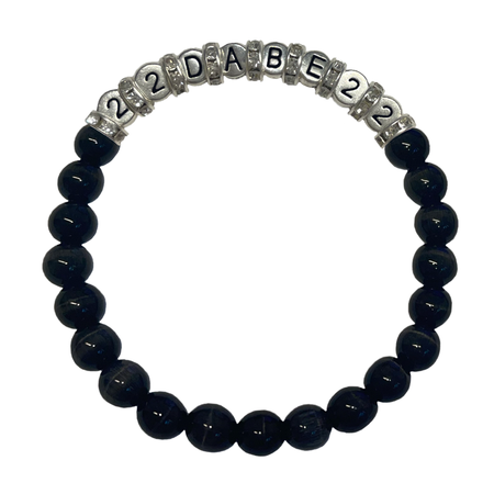 Two Glass Pearl Bracelets by 22DABE22, one in black and the other in white, featuring shimmering glass pearls on a stretchy elastic band. Perfect for elevating your style, formal events or everyday wear. Handcrafted with high-quality materials.
